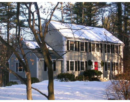 135 Taylor Road Stow, MA 01775 - Photo 1 of 14 a view of house with a yard