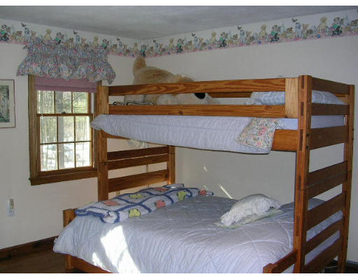 135 Taylor Road Stow, MA 01775 - Photo 11 of 14 a bedroom with a bed and a window