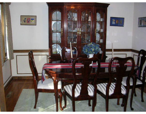 135 Taylor Road Stow, MA 01775 - Photo 2 of 14 a view of a dining room with furniture and chandelier