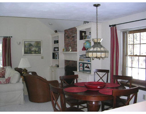 135 Taylor Road Stow, MA 01775 - Photo 6 of 14 a living room with furniture flat screen tv and window
