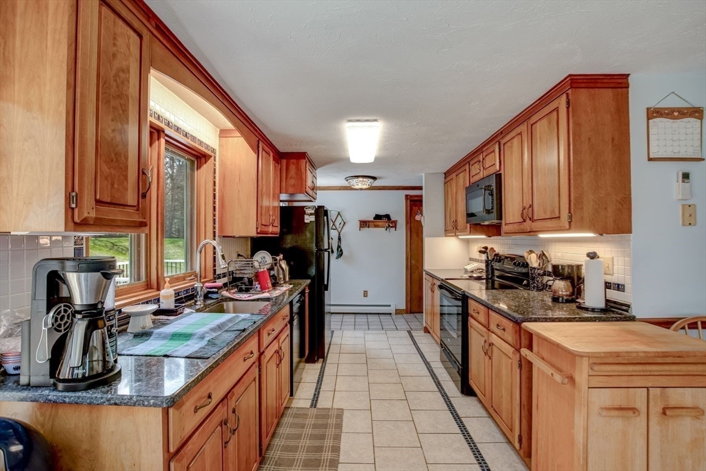 205 East Rindge Road Ashburnham, MA 01430 - Photo 15 of 40 a kitchen with a stove a sink and a refrigerator