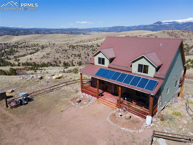 a view of house with yard outdoor seating space