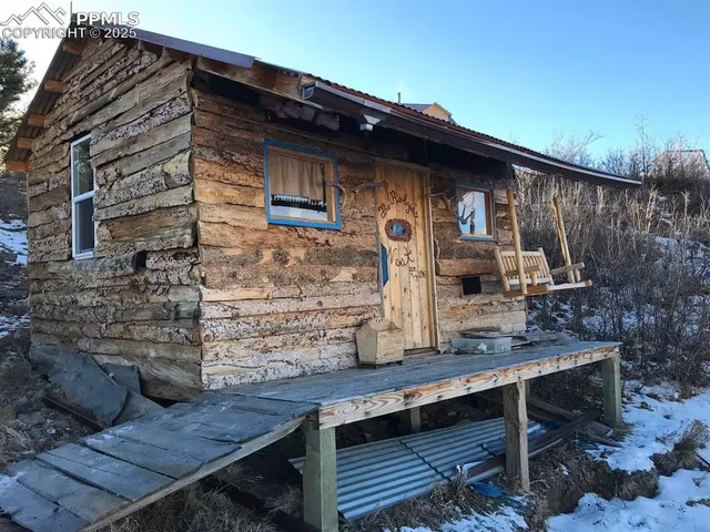 a view of house with outdoor seating