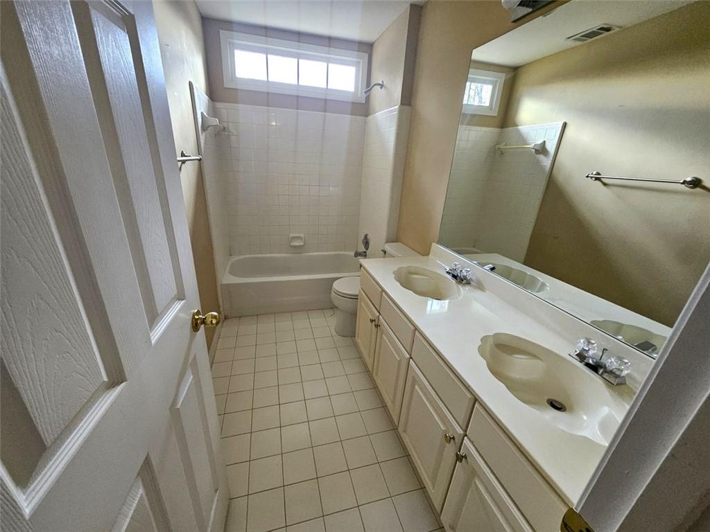 3800 Cherry Ridge Boulevard Decatur, GA 30034 - Photo 21 of 21 a bathroom with a sink a toilet a mirror and shower