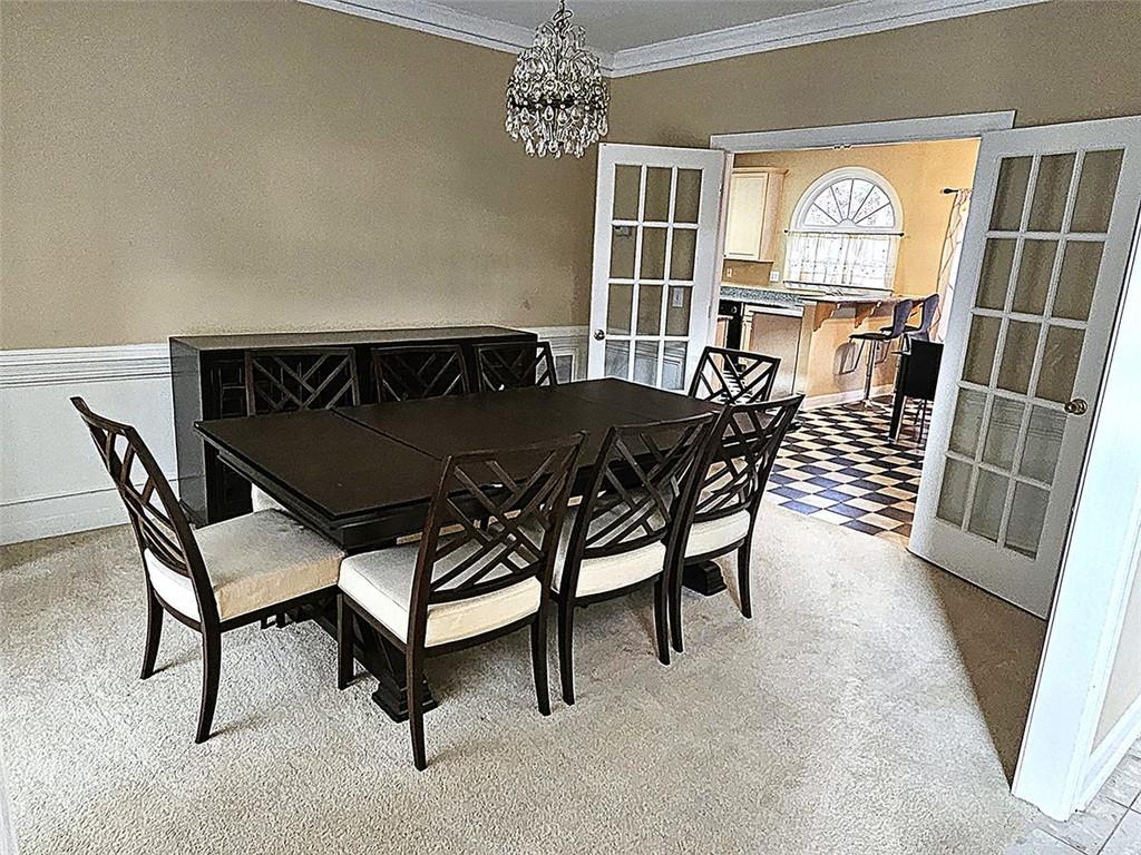 3800 Cherry Ridge Boulevard Decatur, GA 30034 - Photo 5 of 21 a dining room with furniture and a chandelier