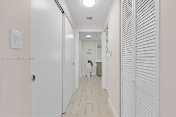 a view of a room with wooden floor