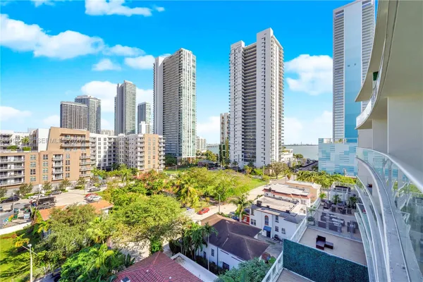 a kitchen with stainless steel appliances a stove top oven and sink