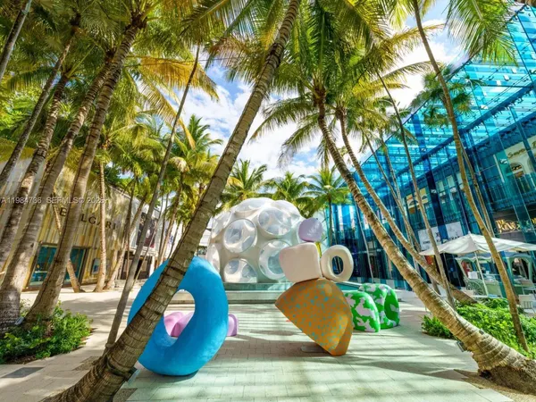 a view of outdoor space with palm trees