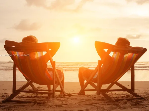 a swimming pool with outdoor seating and yard