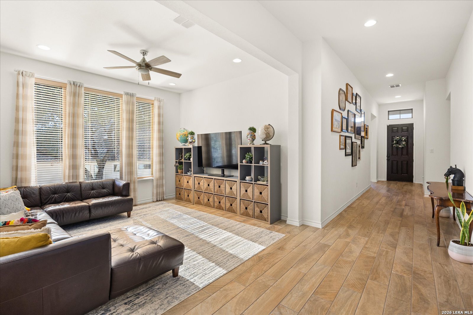117 Amarosa Boerne, TX 78006 - Photo 19 of 62 a living room with furniture and a book shelf