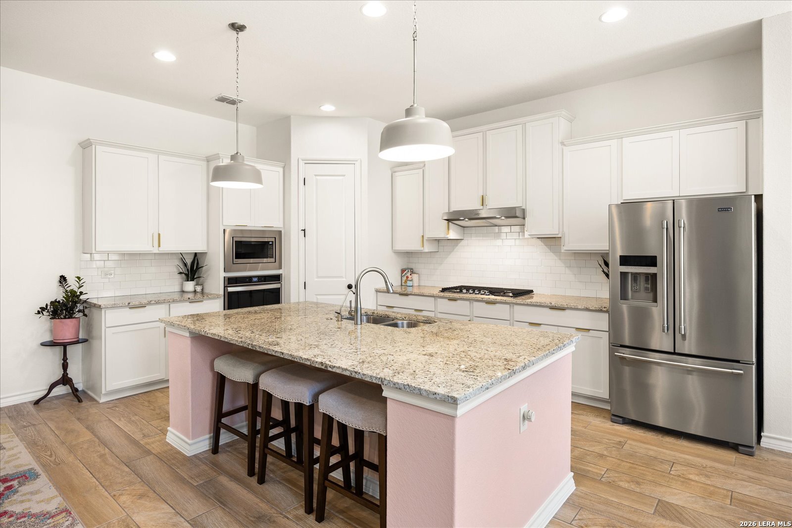 117 Amarosa Boerne, TX 78006 - Photo 27 of 62 a kitchen with stainless steel appliances granite countertop a sink stove and refrigerator