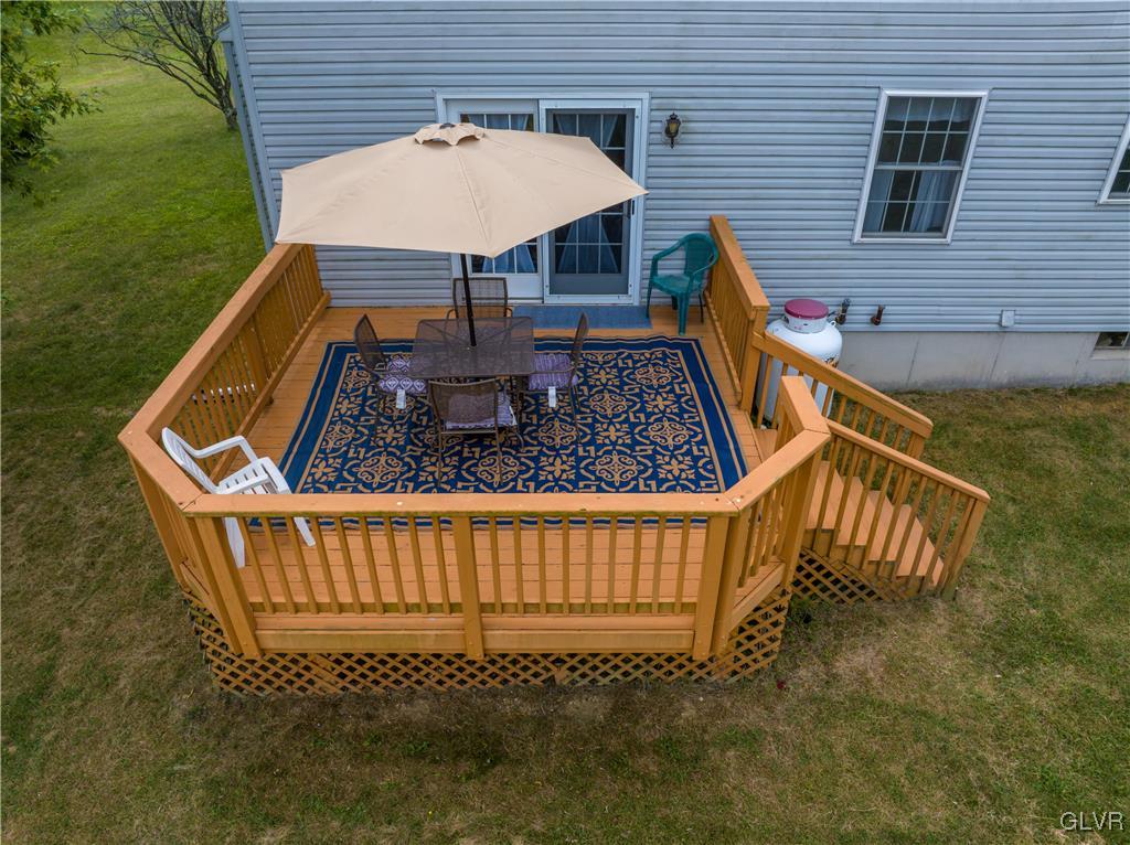 2534 Williams Road Bath, PA 18014 - Photo 36 of 41 a view of a roof deck with a barbeque grill with wooden floor and fence