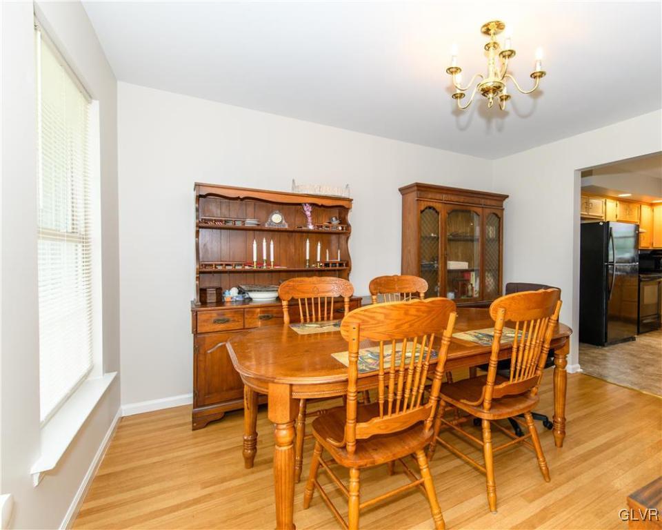 2534 Williams Road Bath, PA 18014 - Photo 8 of 41 a view of a dining room with furniture a chandelier and wooden floor