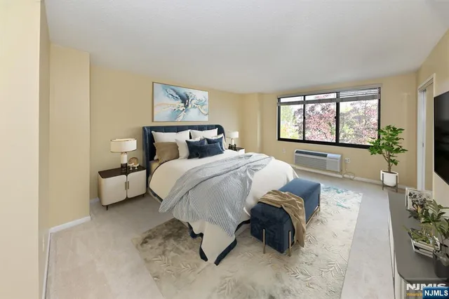 a spacious bedroom with a bed and window