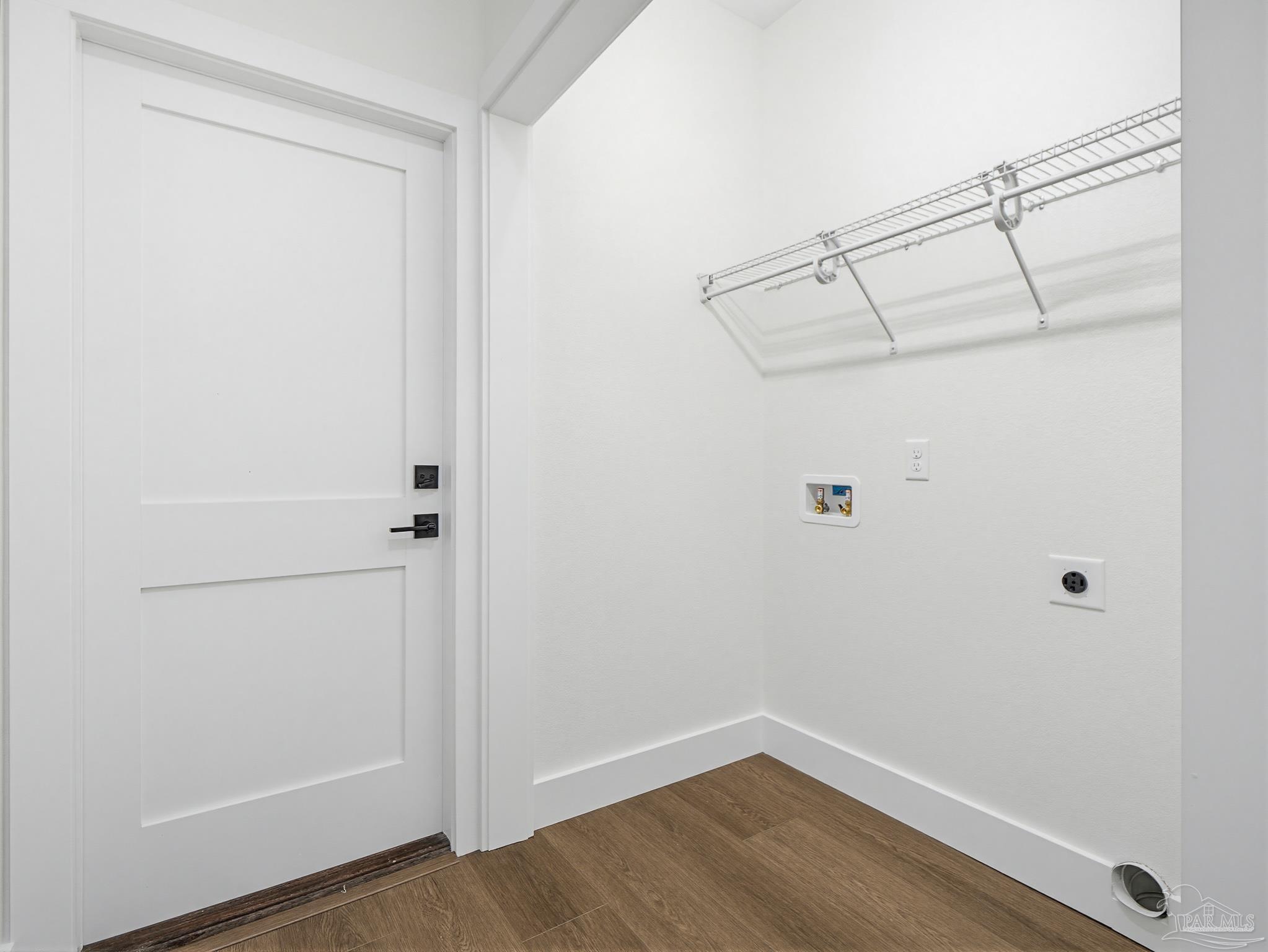 5724 Riviera Drive Milton, FL 32583 - Photo 36 of 52 a view of a room with wooden floor