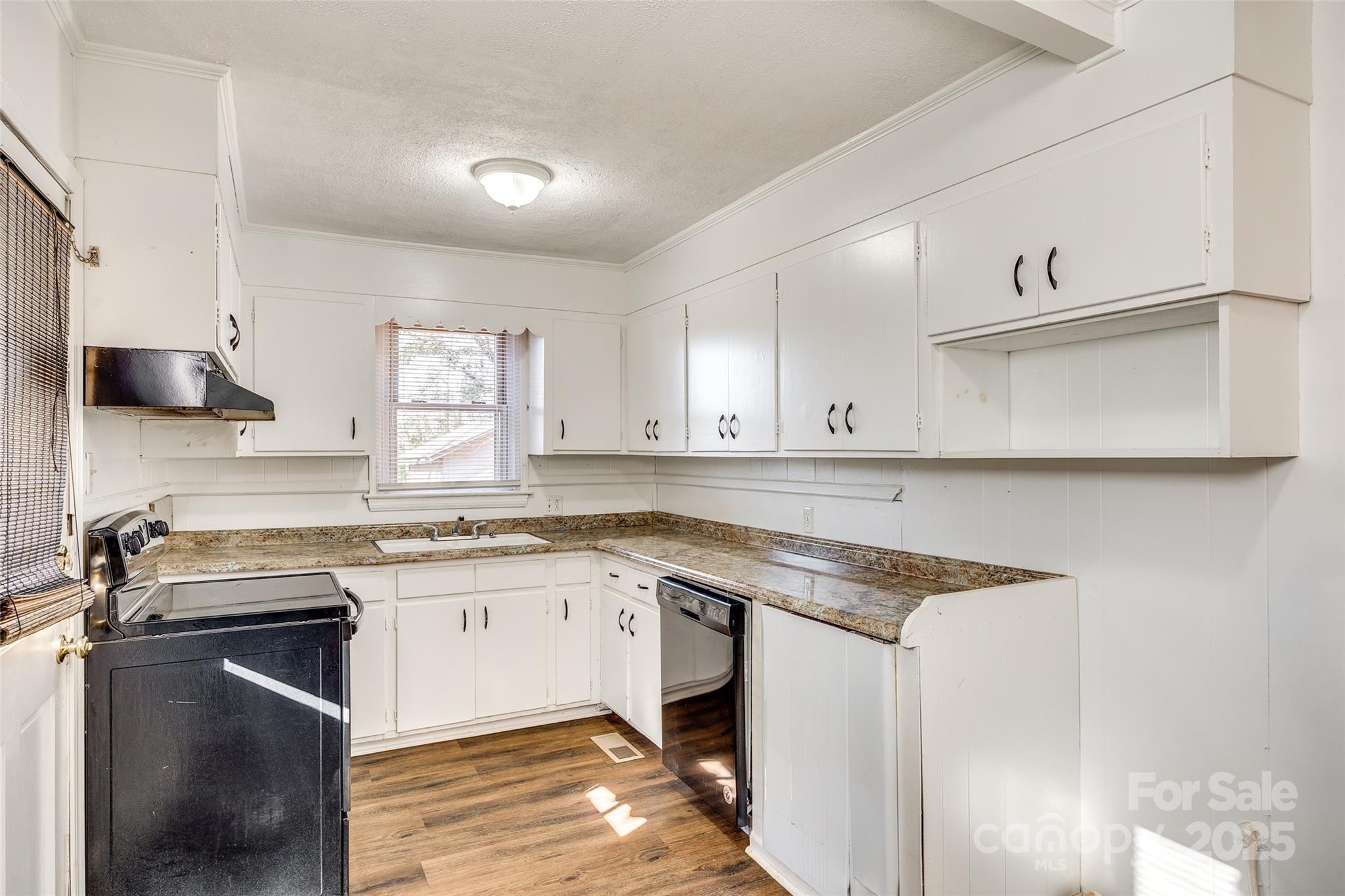 1337 Eisenhower Road Rock Hill, SC 29730 - Photo 6 of 21 a kitchen with a sink stove and cabinets