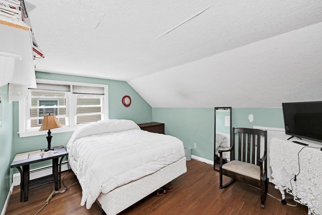 40 Dedham Street Boston, MA 02136 - Photo 11 of 24 a bedroom with a bed and a flat screen tv