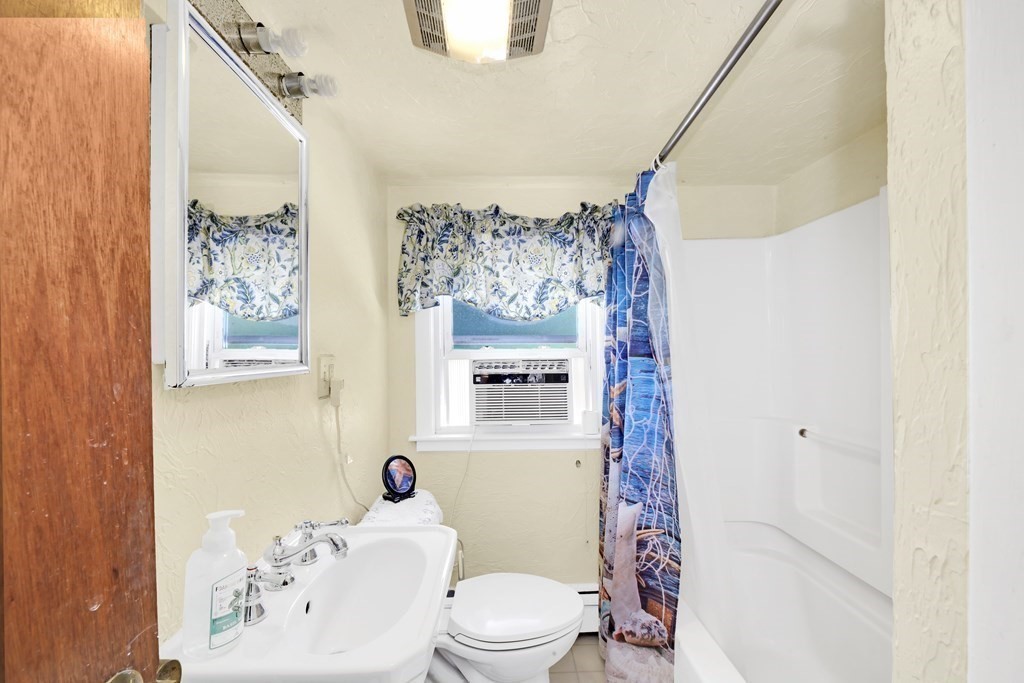 40 Dedham Street Boston, MA 02136 - Photo 12 of 24 a bathroom with a toilet sink and shower