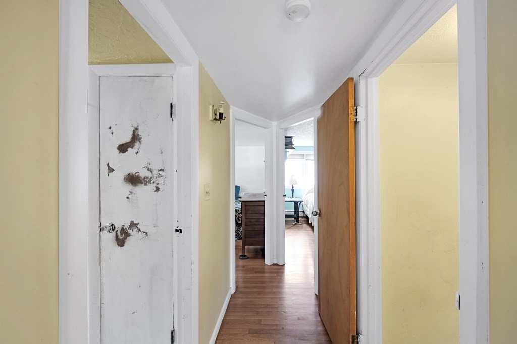 40 Dedham Street Boston, MA 02136 - Photo 16 of 24 a view of a hallway with wooden shelves