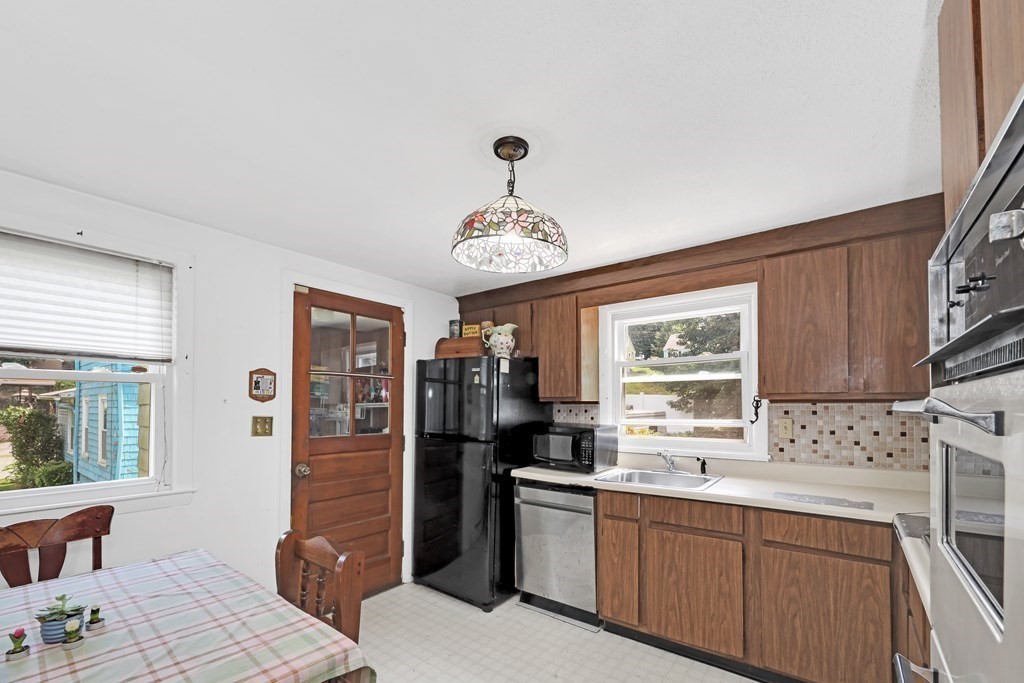 40 Dedham Street Boston, MA 02136 - Photo 4 of 24 a kitchen with stainless steel appliances a sink stove and refrigerator