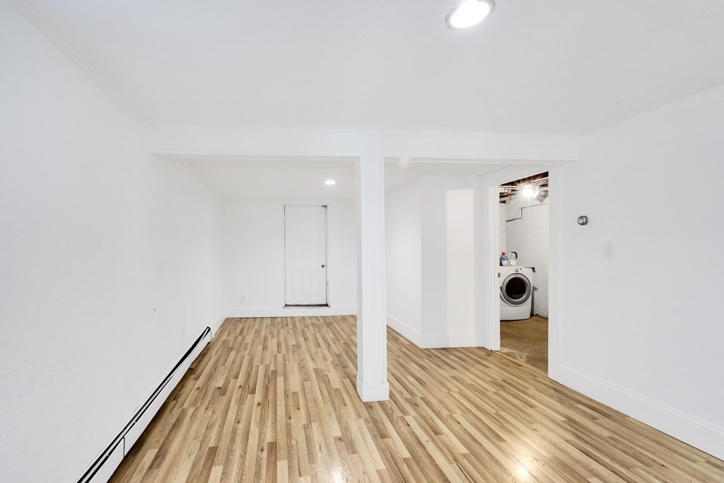 40 Dedham Street Boston, MA 02136 - Photo 5 of 24 a view of a room with wooden floor and staircase