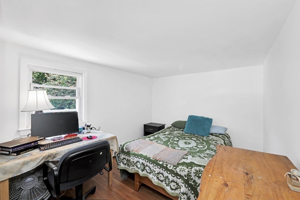 40 Dedham Street Boston, MA 02136 - Photo 9 of 24 a bedroom with a bed and a computer on a table