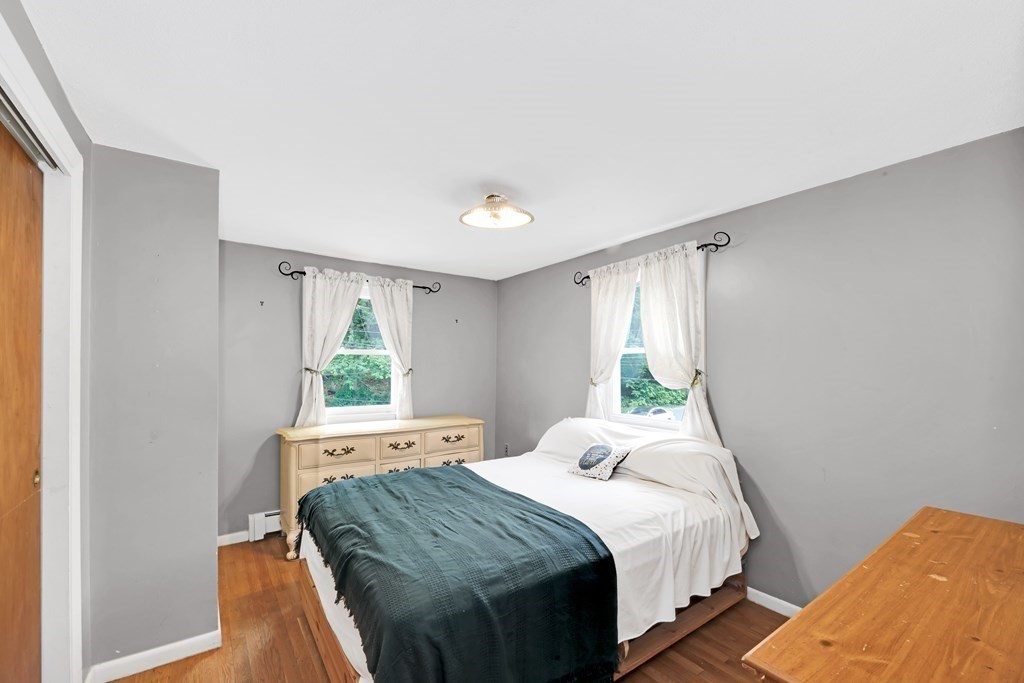 40 Dedham Street Boston, MA 02136 - Photo 10 of 24 a bedroom with a bed and a window