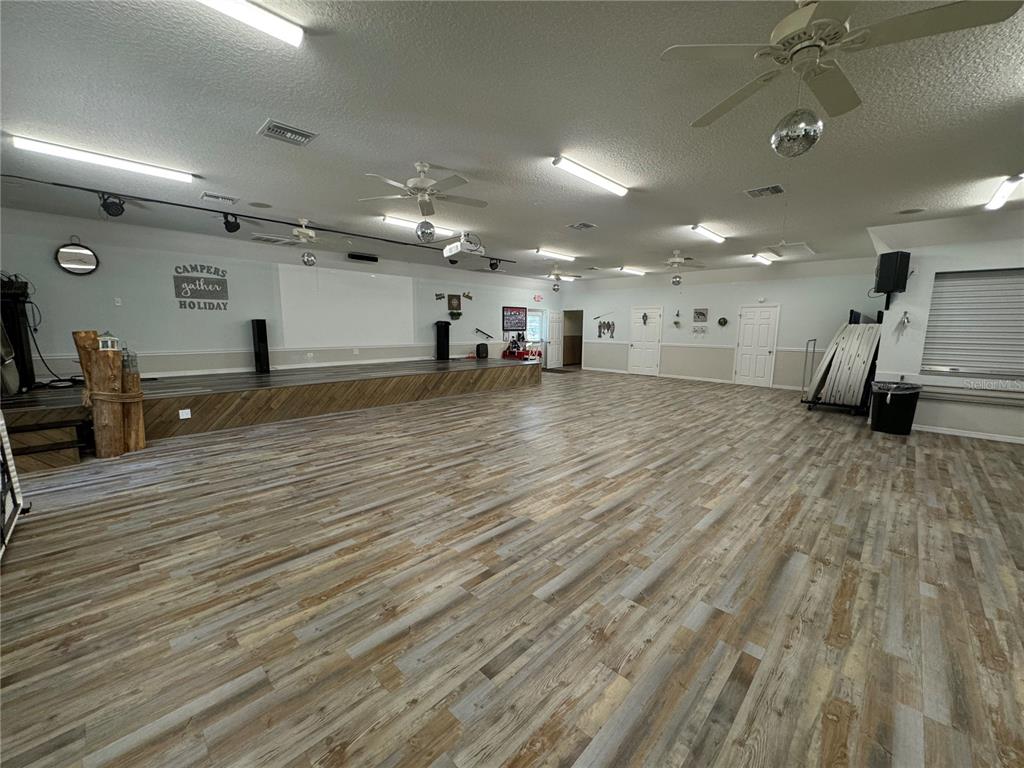 2092 Culbreath Road, Unit C52 Brooksville, FL 34602 - Photo 25 of 33 a view of a room with gym equipment and windows