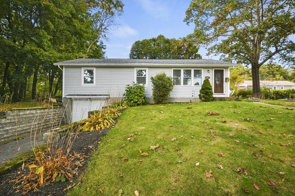 front view of a house with a yard
