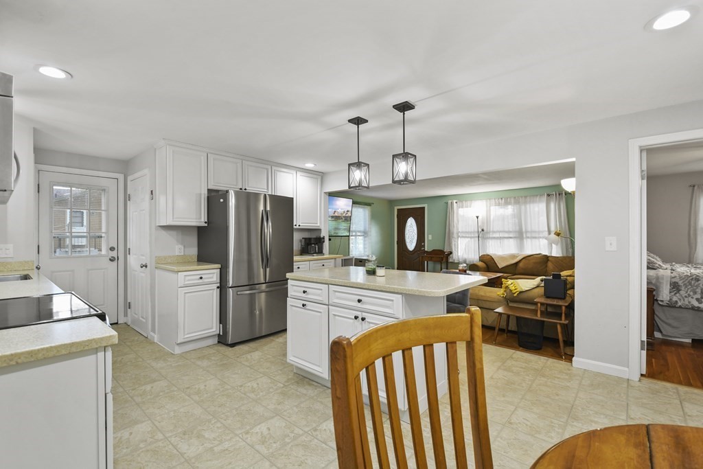 26 Westwood Road Webster, MA 01570 - Photo 11 of 30 a kitchen with refrigerator and cabinets