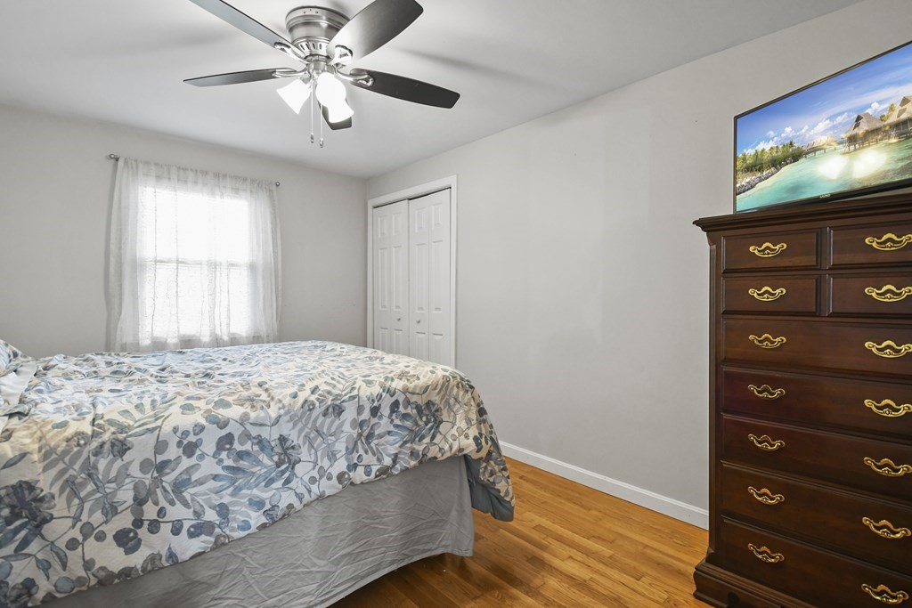 26 Westwood Road Webster, MA 01570 - Photo 12 of 30 a bedroom with a bed and a flat screen tv