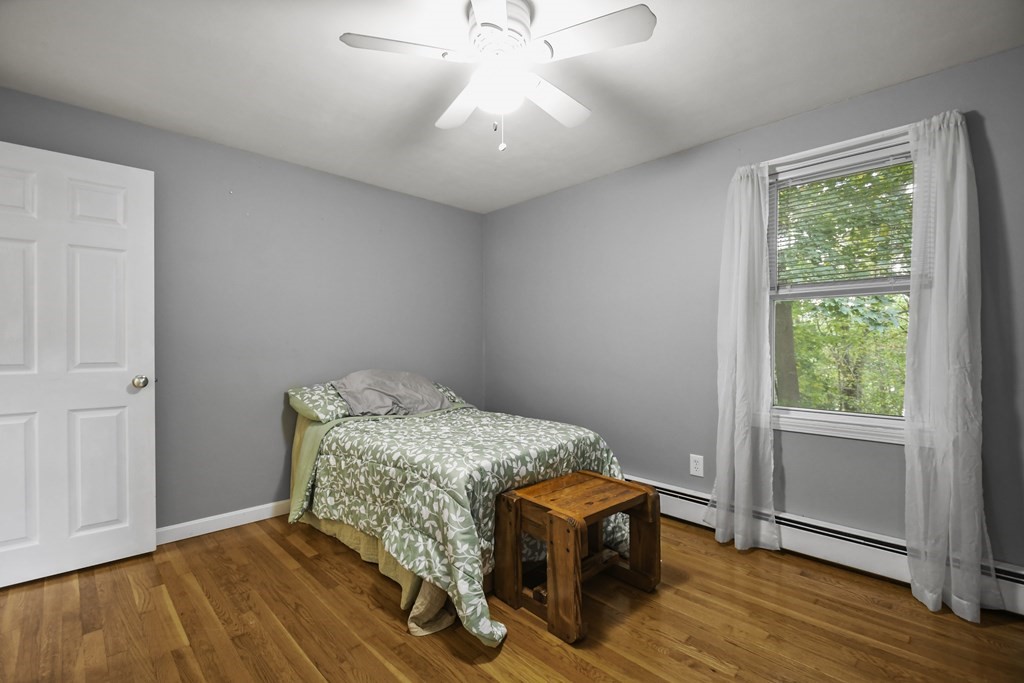 26 Westwood Road Webster, MA 01570 - Photo 17 of 30 a bedroom with a bed and a window