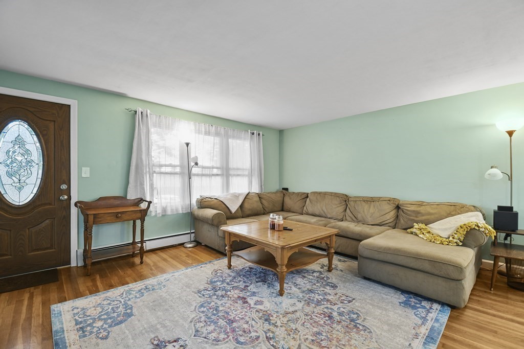 26 Westwood Road Webster, MA 01570 - Photo 2 of 30 a living room with furniture a rug and a large window