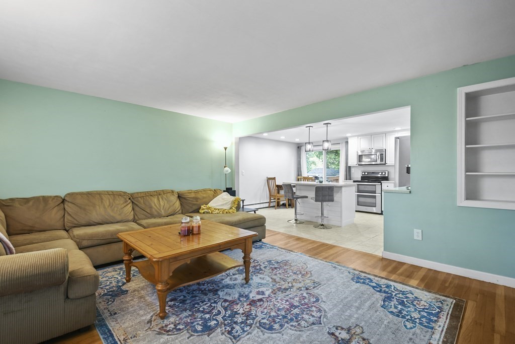 26 Westwood Road Webster, MA 01570 - Photo 3 of 30 a living room with furniture and a rug
