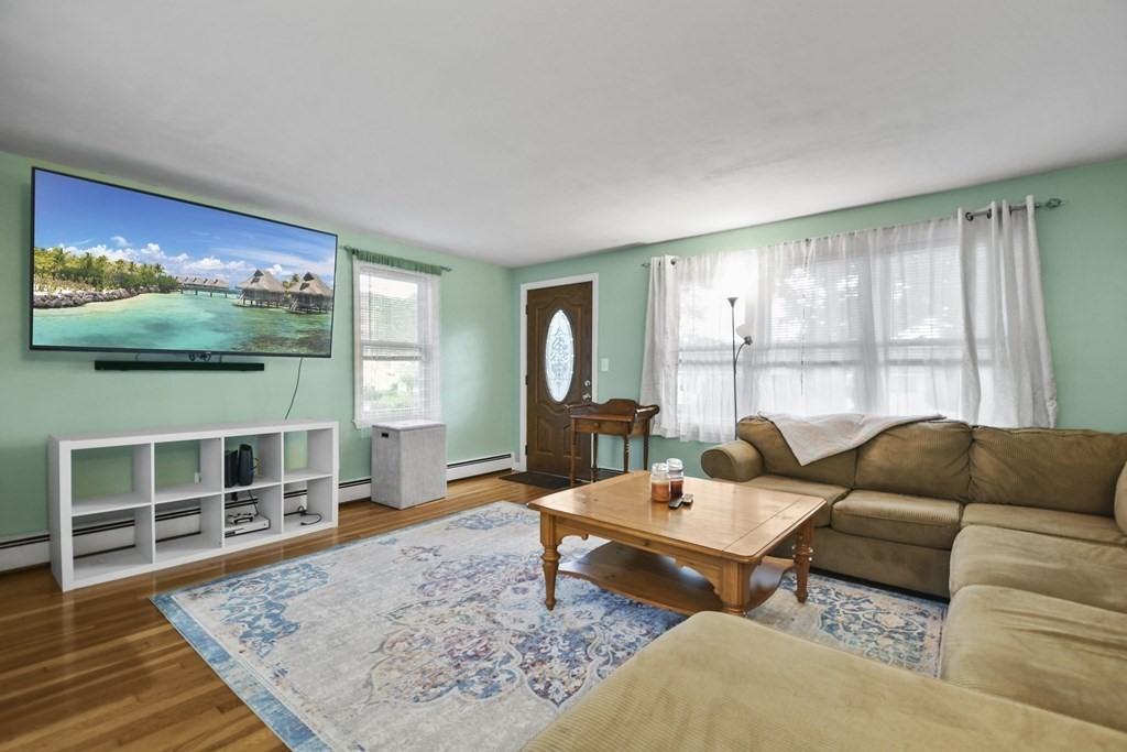 26 Westwood Road Webster, MA 01570 - Photo 4 of 30 a living room with furniture and a flat screen tv