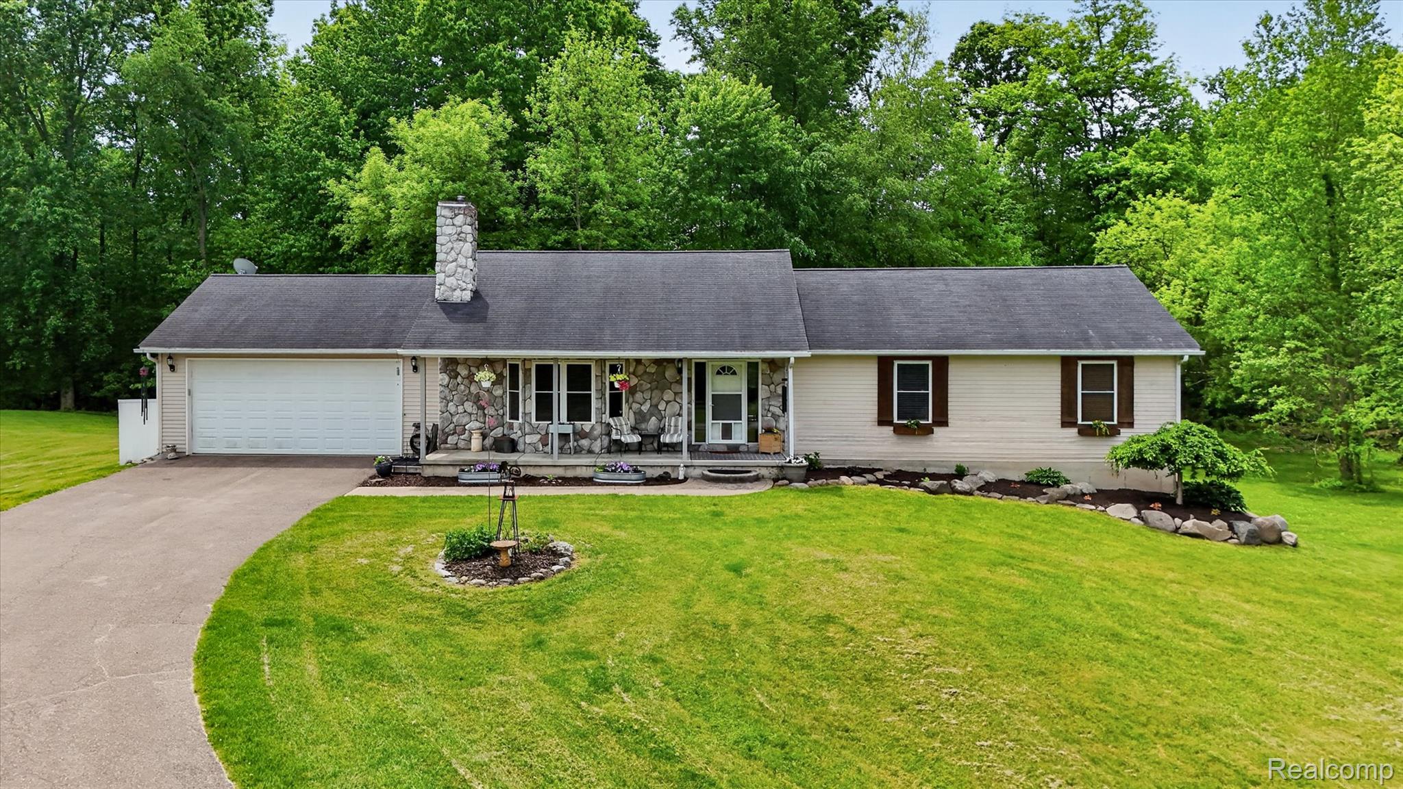 9565 Crofoot Road Fowlerville, MI 48836 - Photo 45 of 63 Ranch-style residence featuring a stone facade and a two-car garage