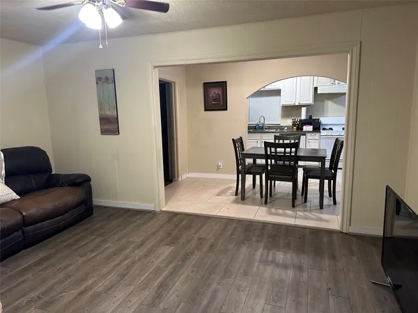a view of a livingroom with furniture and a flat screen tv