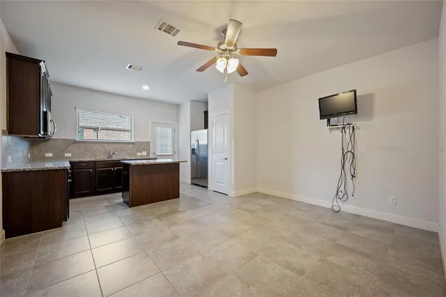 a kitchen with a cabinets and appliances