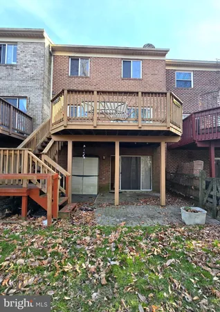 a front view of a residential apartment building with a yard