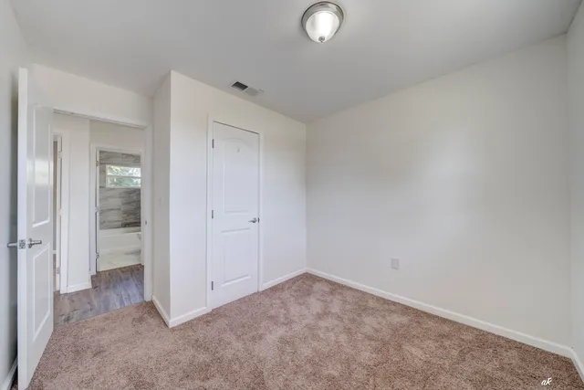 an empty room with mirror in it