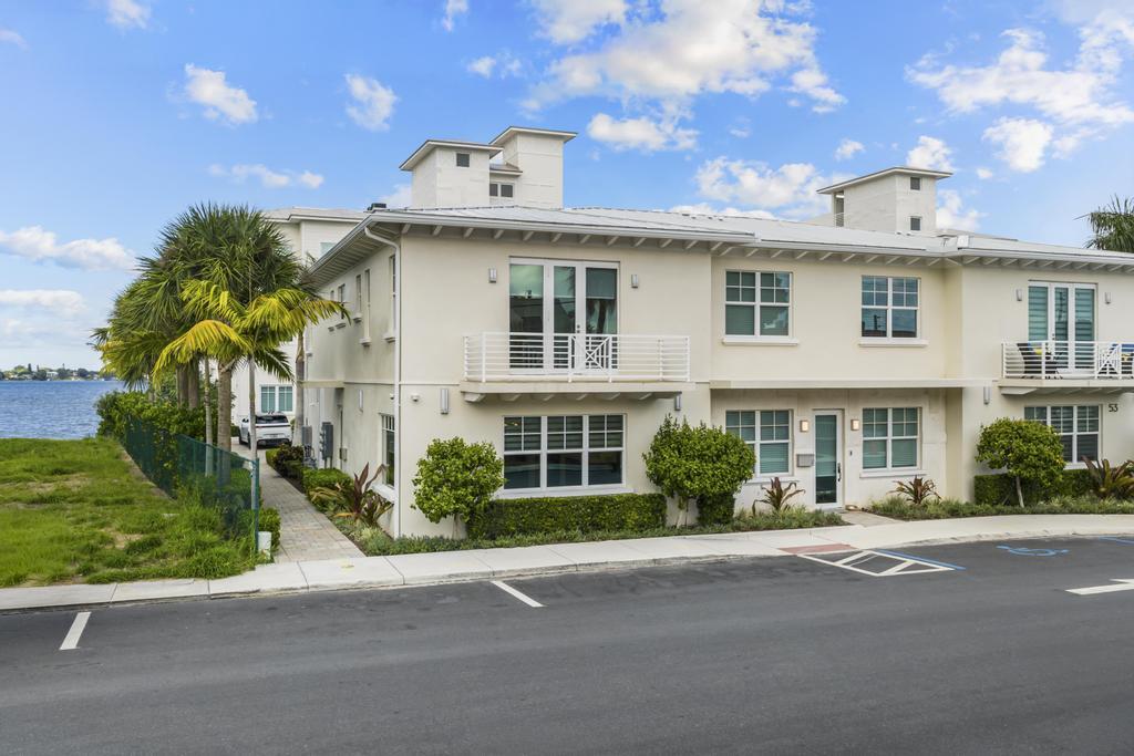 53 Southeast Seminole Street, Unit A Stuart, FL 34994 - Photo 3 of 75 a front view of a house with a yard