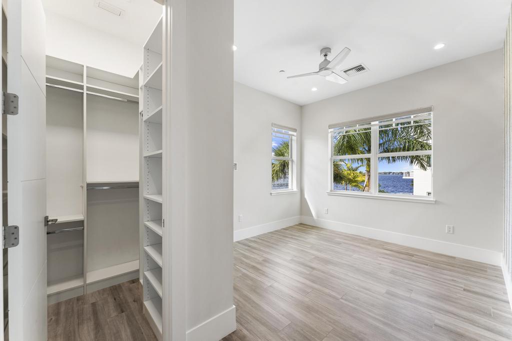 53 Southeast Seminole Street, Unit A Stuart, FL 34994 - Photo 46 of 75 wooden floor in an empty room with a window