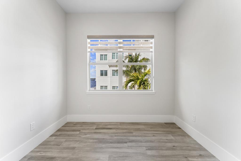 53 Southeast Seminole Street, Unit A Stuart, FL 34994 - Photo 53 of 75 a view of an empty room with window
