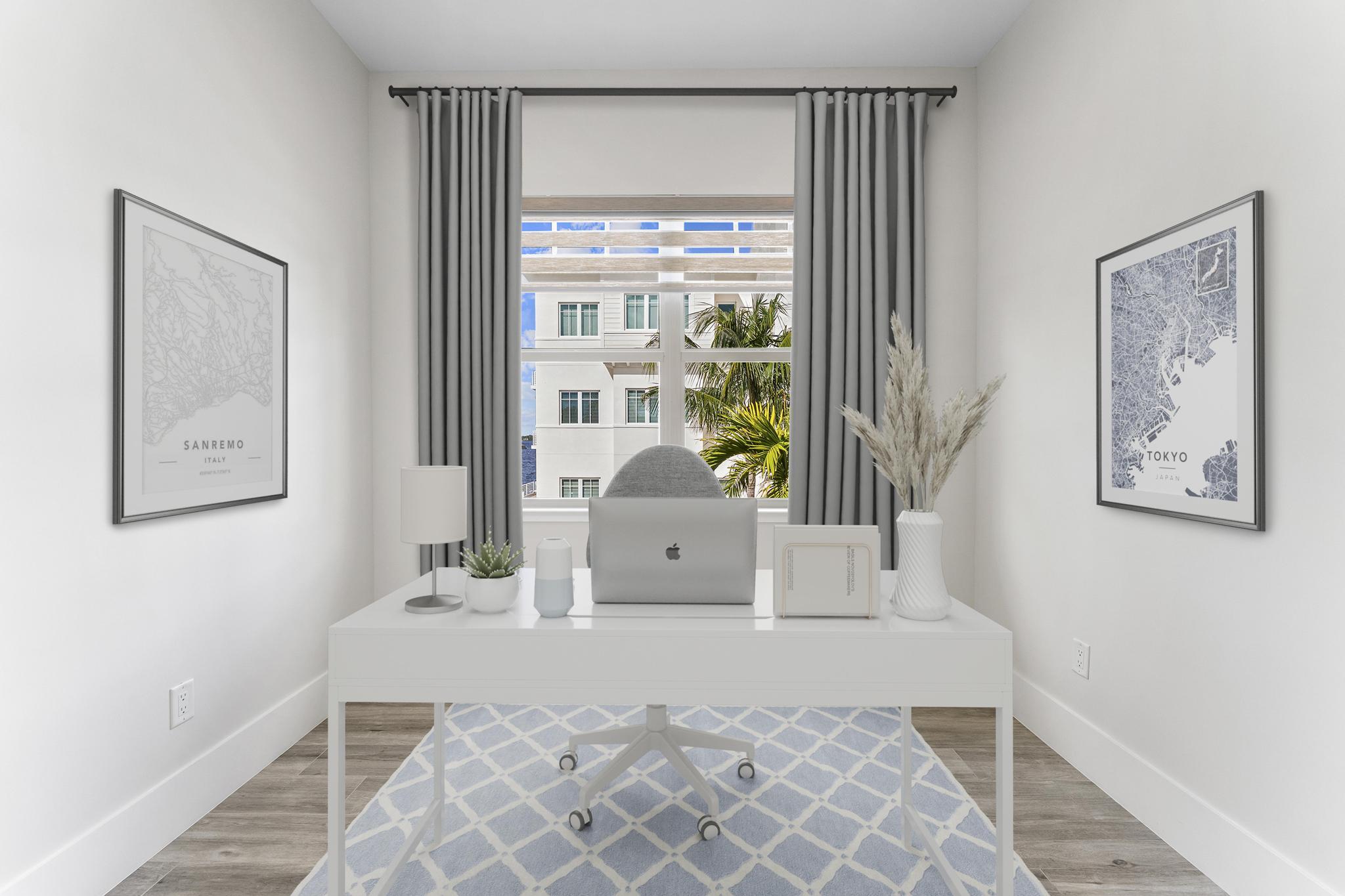 53 Southeast Seminole Street, Unit A Stuart, FL 34994 - Photo 54 of 75 a living room with furniture and a floor to ceiling window