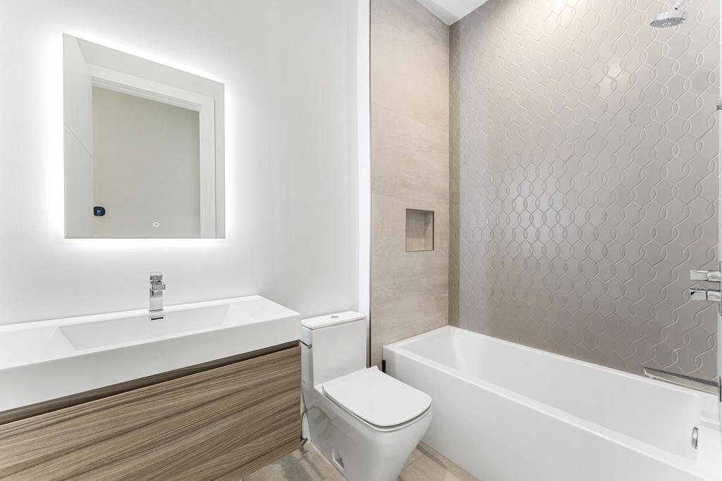 53 Southeast Seminole Street, Unit A Stuart, FL 34994 - Photo 55 of 75 a bathroom with a sink toilet and a bathtub