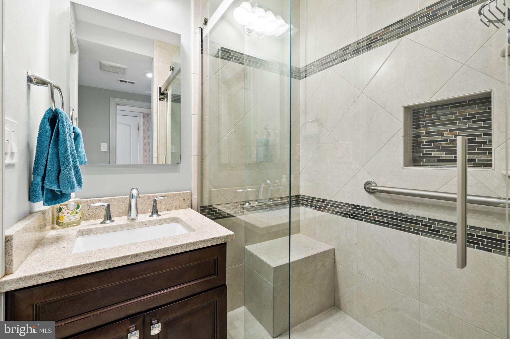 6397 Tazewell Street Warrenton, VA 20187 - Photo 14 of 41 Modern elegance in a sleek bathroom retreat.