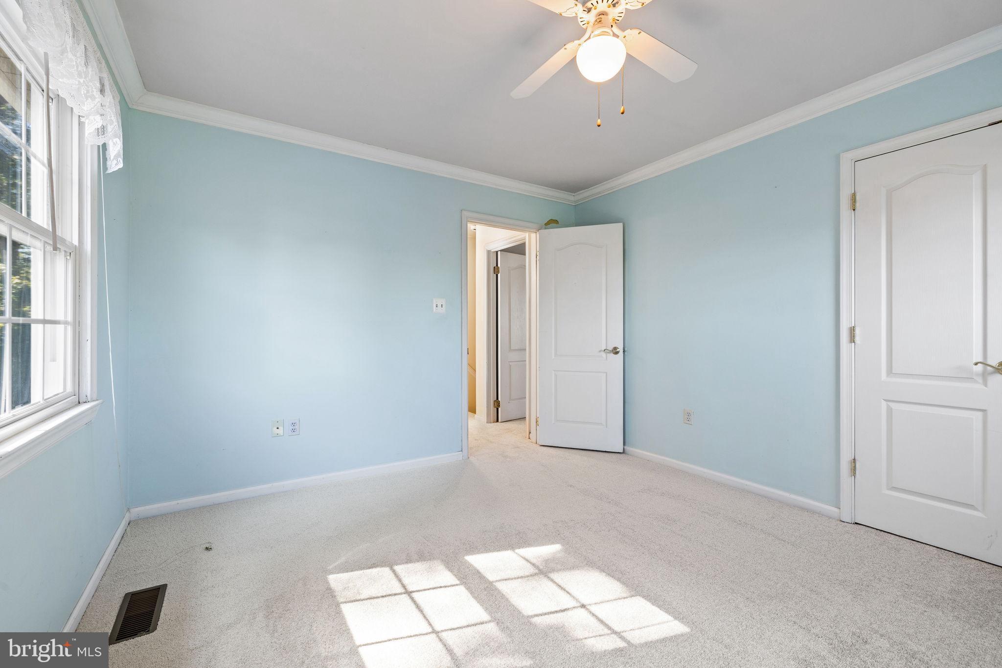 6397 Tazewell Street Warrenton, VA 20187 - Photo 26 of 41 Bright and airy room with soft blue walls.