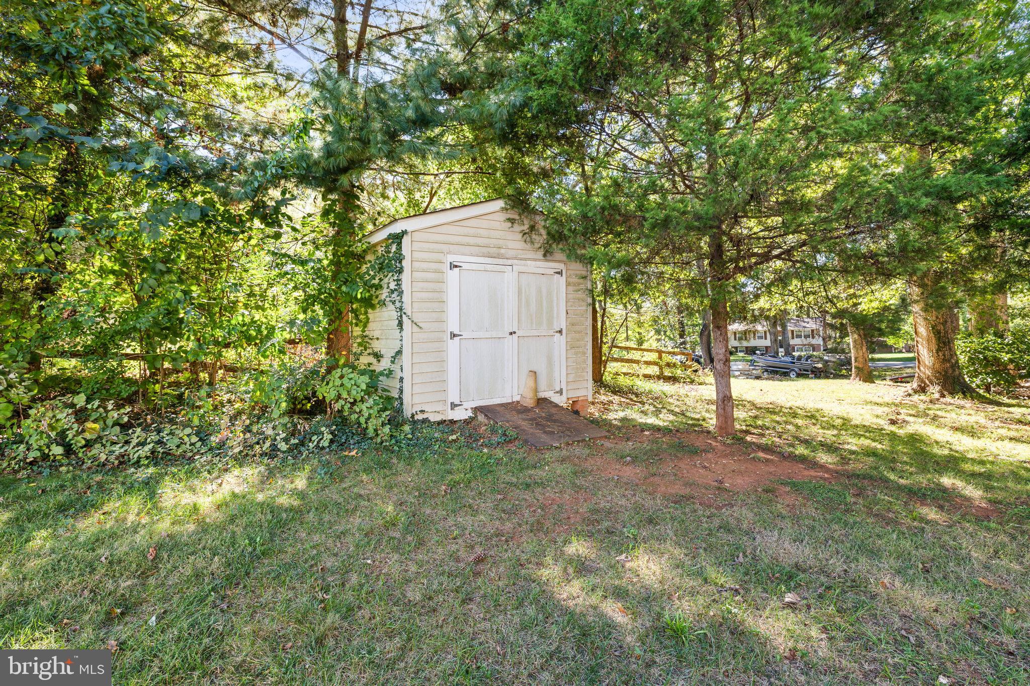6397 Tazewell Street Warrenton, VA 20187 - Photo 31 of 41 Charming shed nestled in a lush backyard.