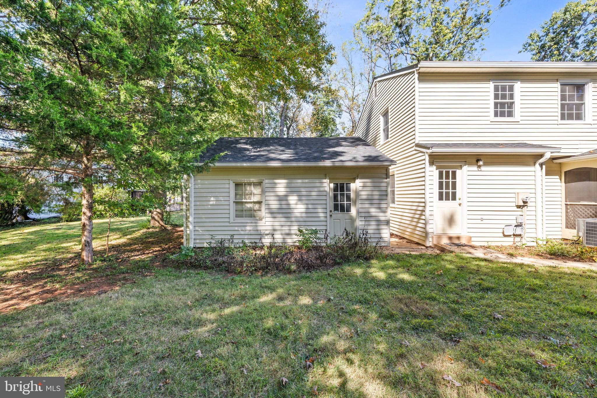 6397 Tazewell Street Warrenton, VA 20187 - Photo 32 of 41 Charming home with lush greenery backdrop.