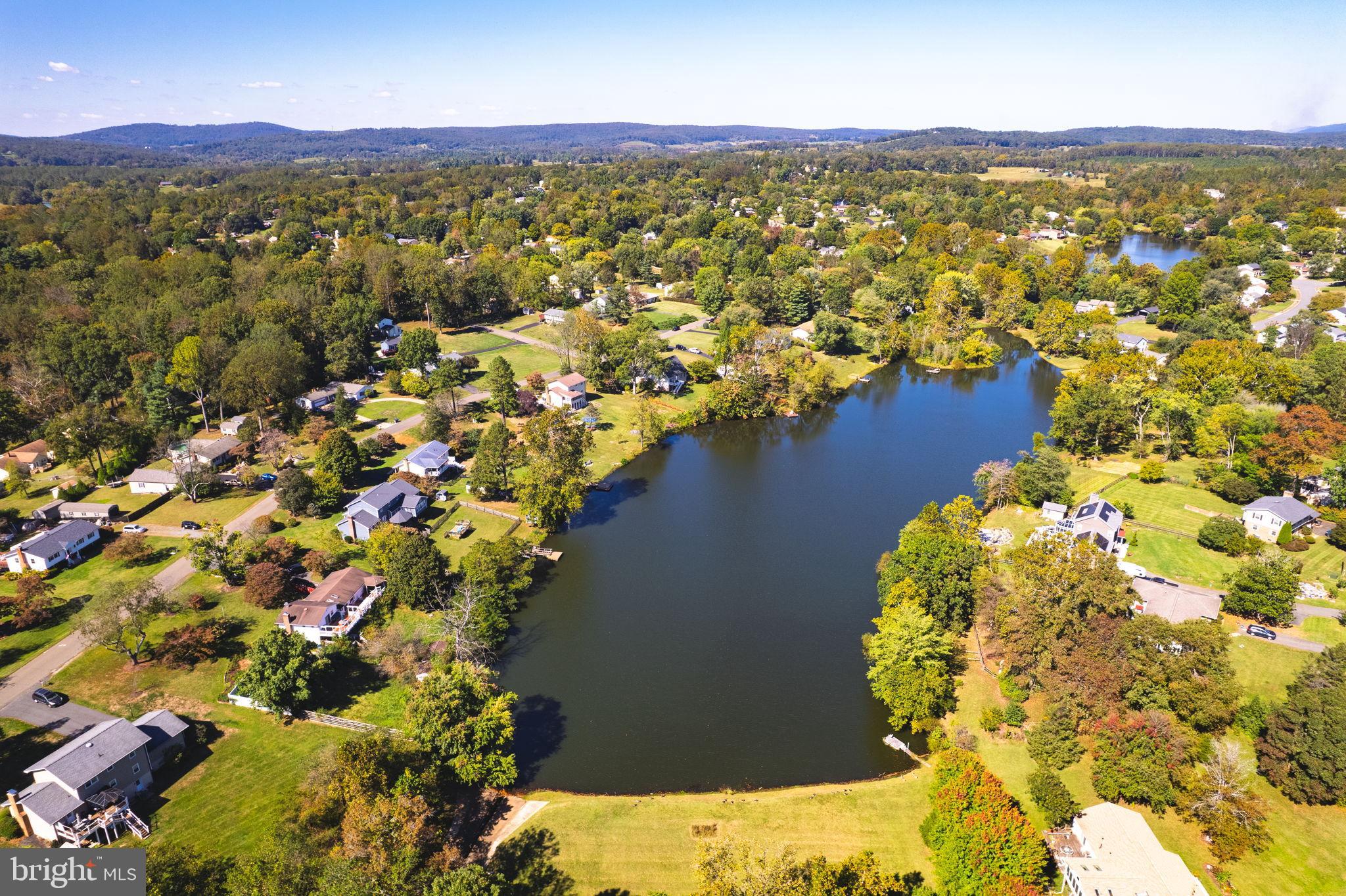 6397 Tazewell Street Warrenton, VA 20187 - Photo 38 of 41 Serene lakeside community in vibrant autumn hues.